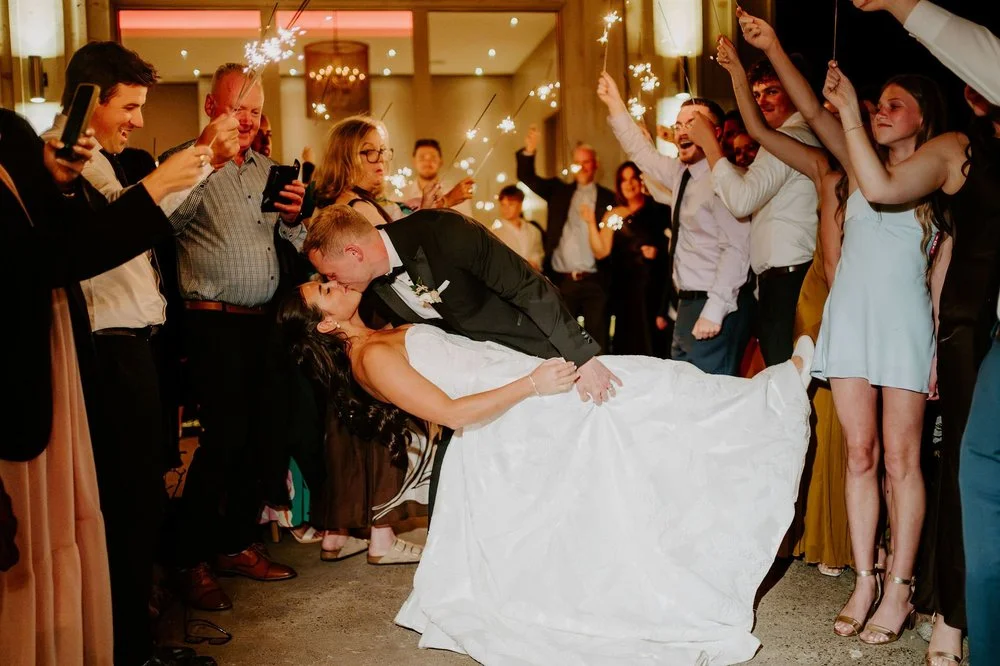 Will dipping Kylie for a kiss as guests hold sparklers for their send-off at Le Belvedere