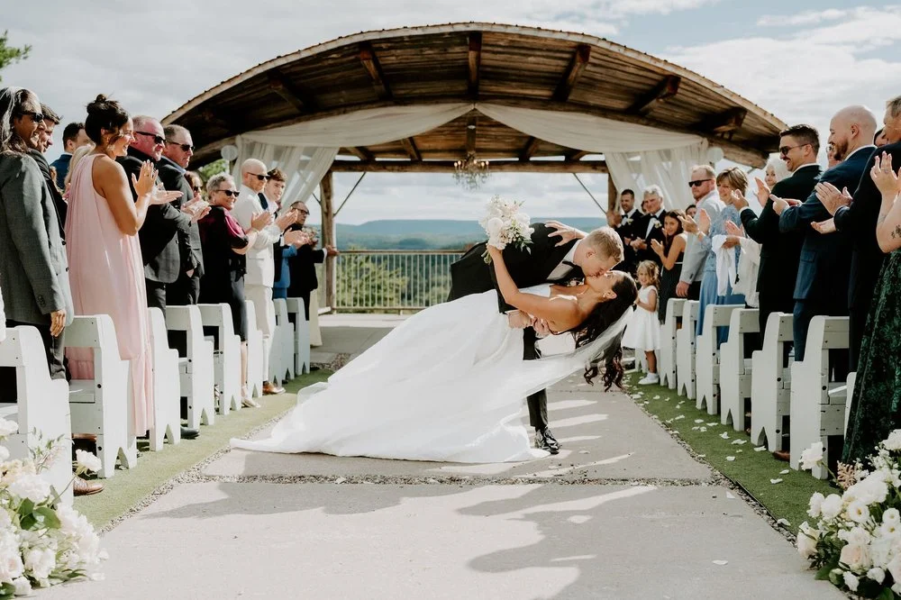 Will dipping Kylie for a kiss in the aisle as guests cheer at Le Belvedere