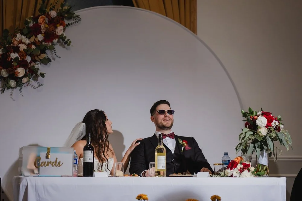 bride and groom reacting to a wedding speech