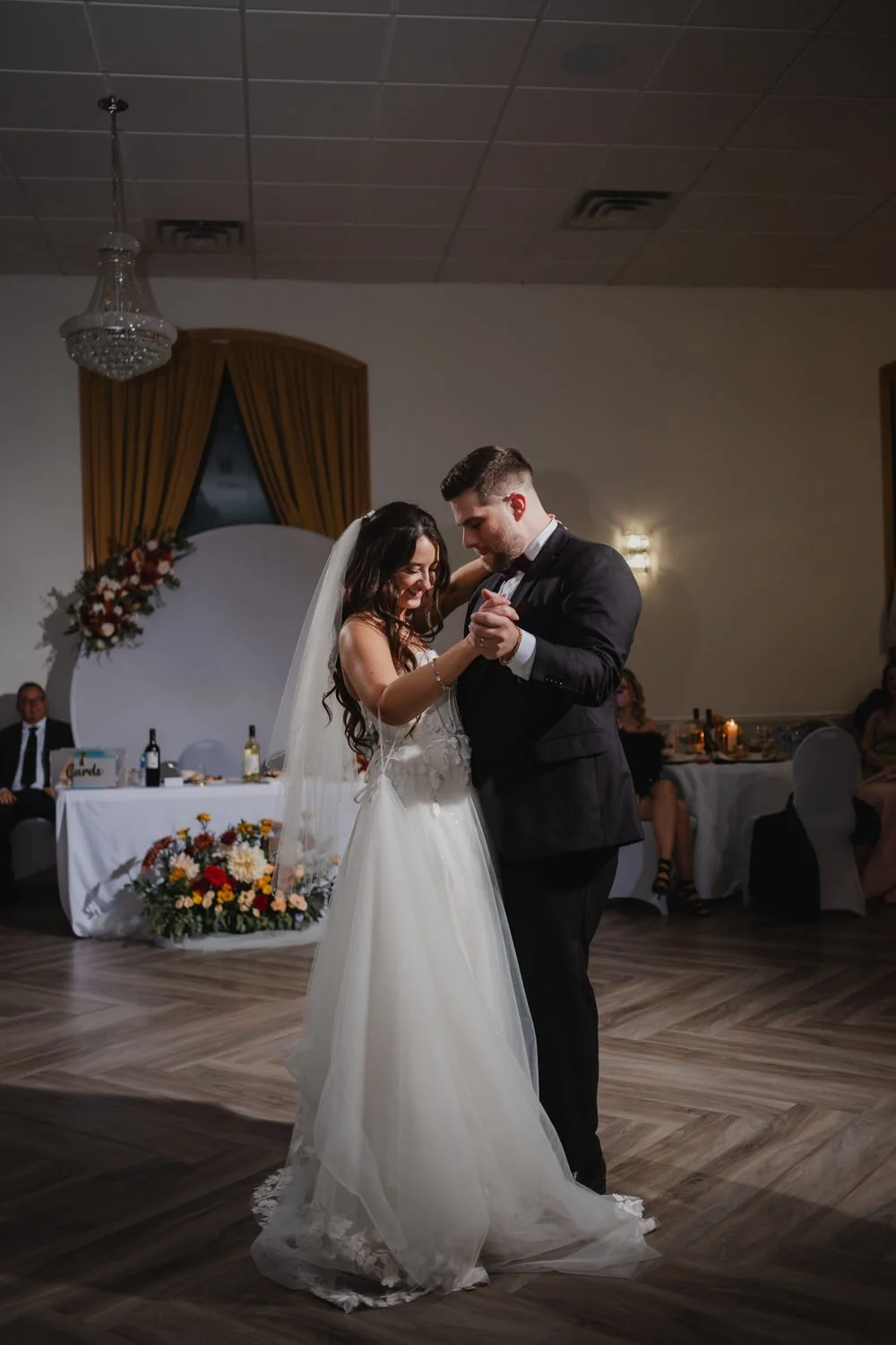 a first dance wedding photo in a reception hall