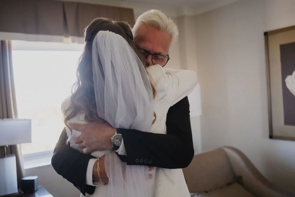 emotional embrace between bride and her dad