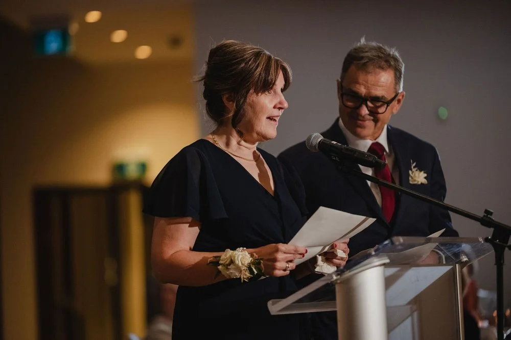 photo of someone giving a speech at a national arts centre wedding reception.