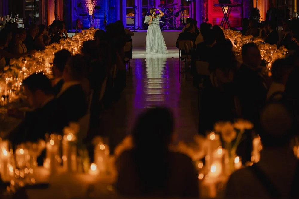 a wedding reception in the candle lit ball room at the chateau laurier