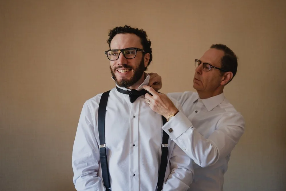 photo of a groom getting ready at the chateau laurier