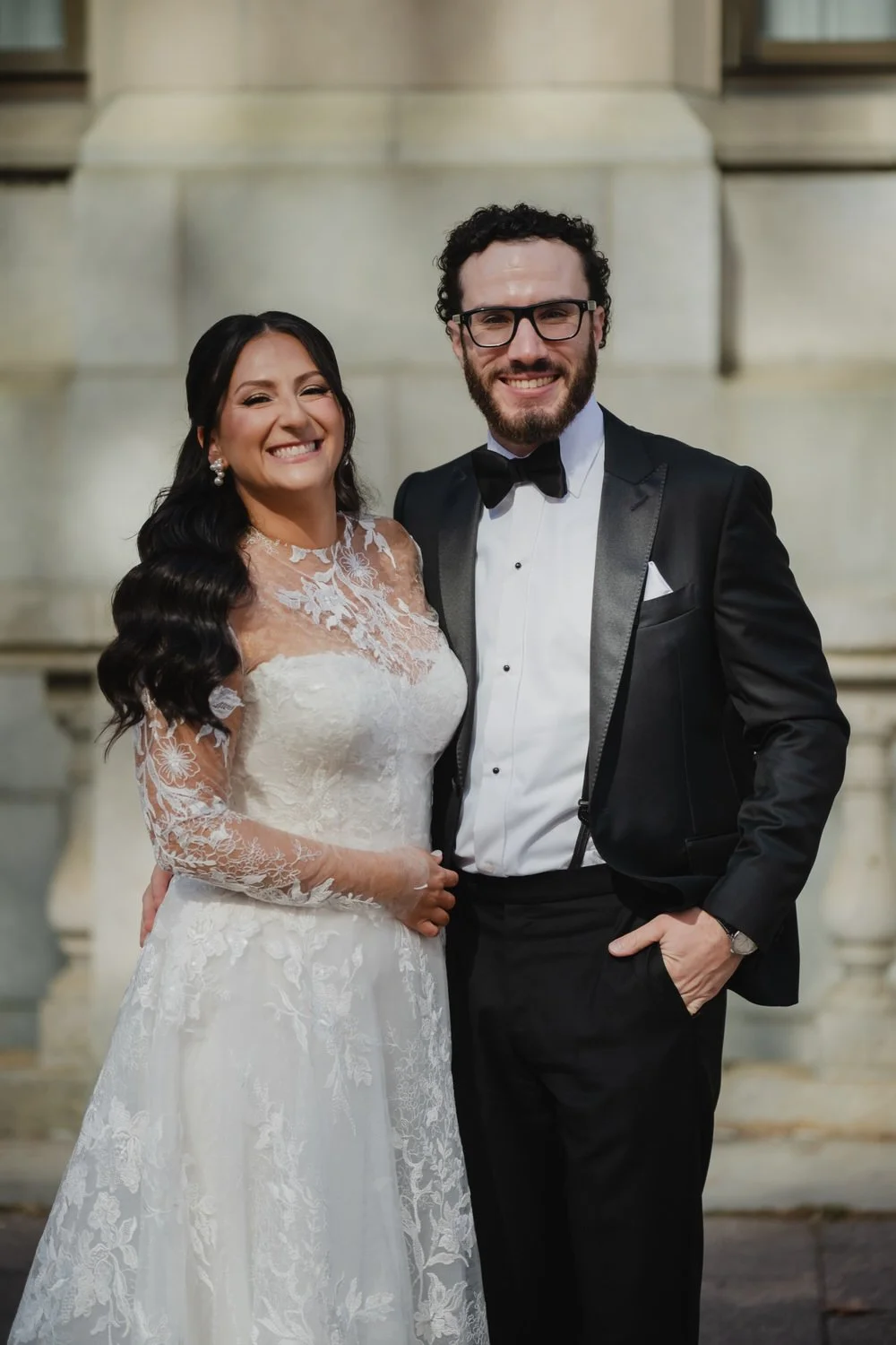 Portrait of a bride and groom outside of the Chateau Laurier