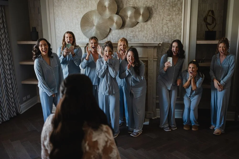 bridesmaids seeing the bride in her wedding dress for the first time.