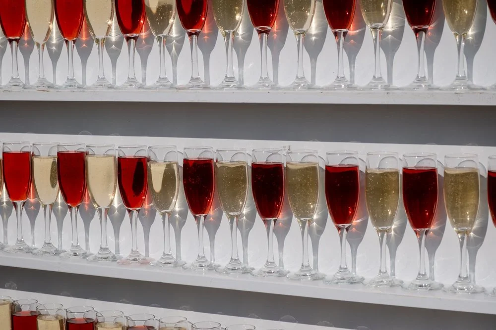 wine glasses lined up for a toast