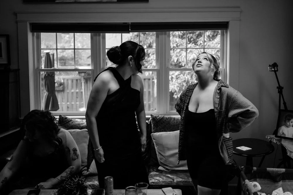 black and white photo of a bride getting ready for her wedding