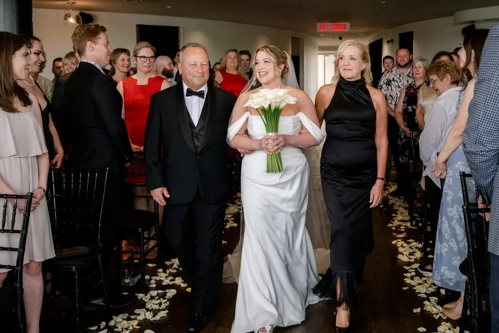 bride walking down the aisle at Lago