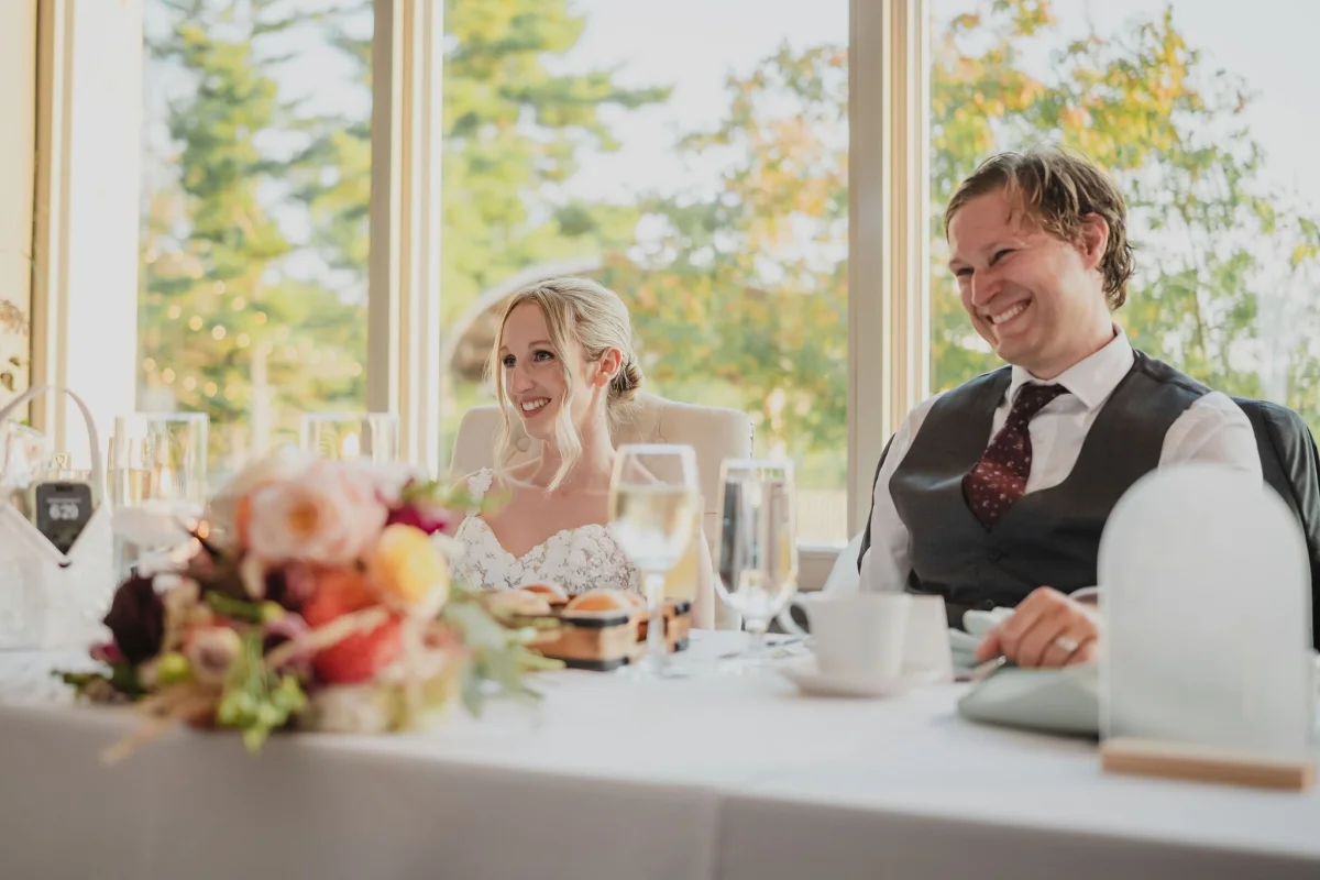 bride and groom reacting to a speech
