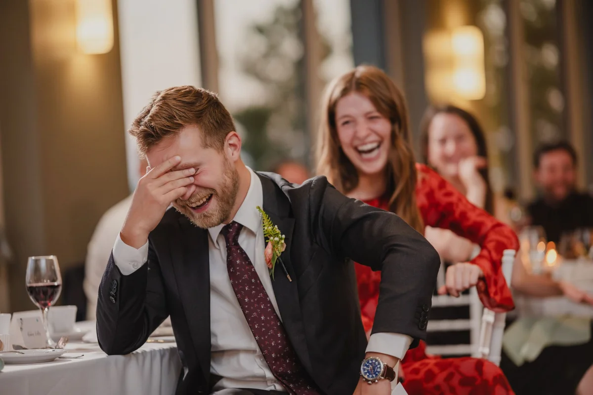 wedding guest laughing