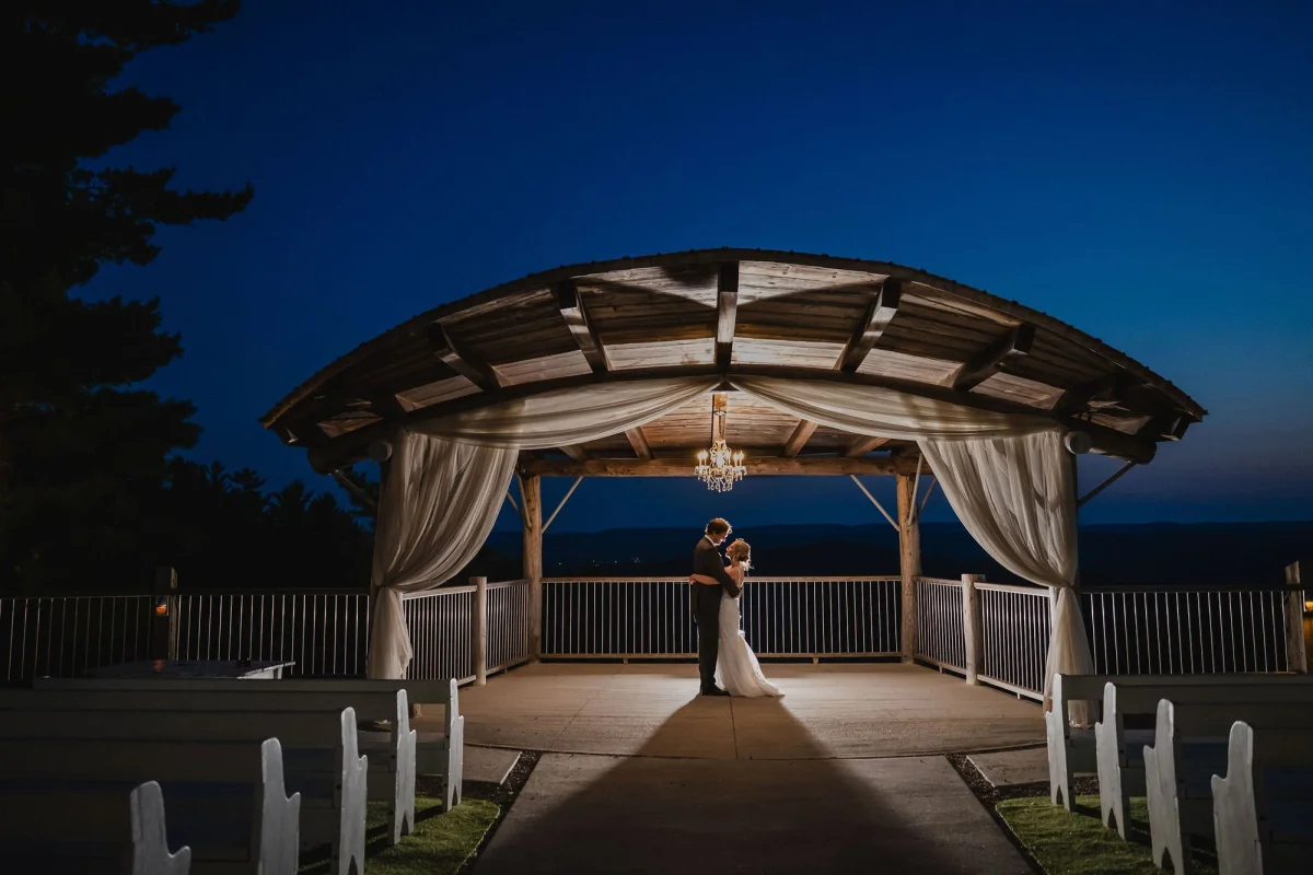 night time backlit photo of a bride and groom