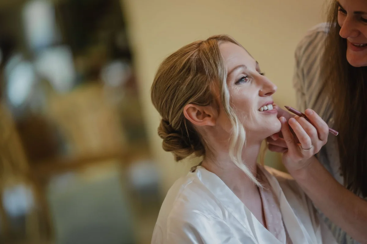 bride getting her makeup done