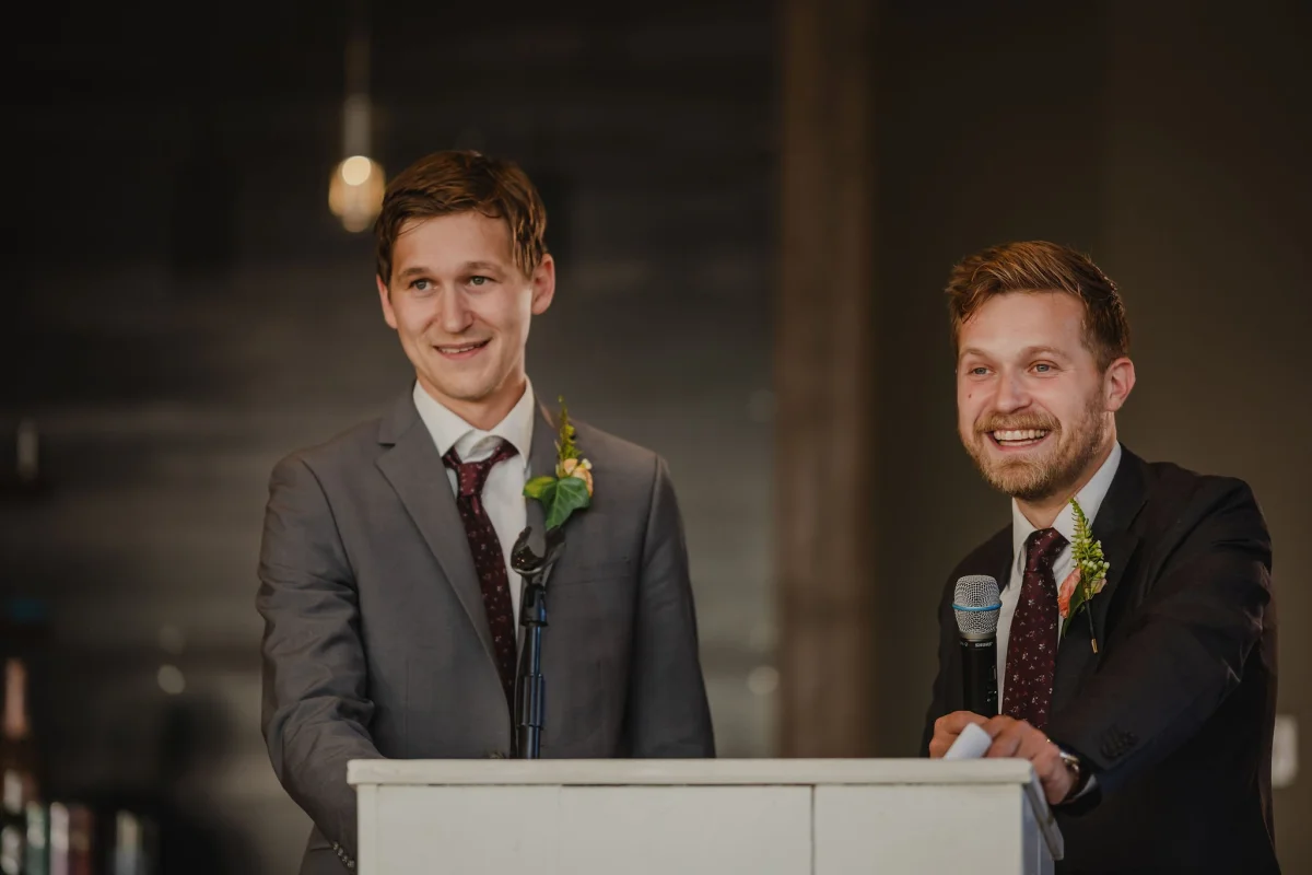 groomsmen giving a speech at a wedding
