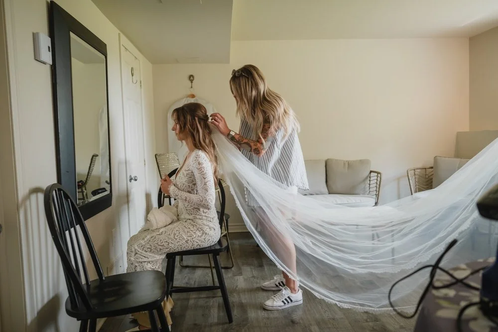 photo of a bride getting ready for her wedding ad Adelina barn