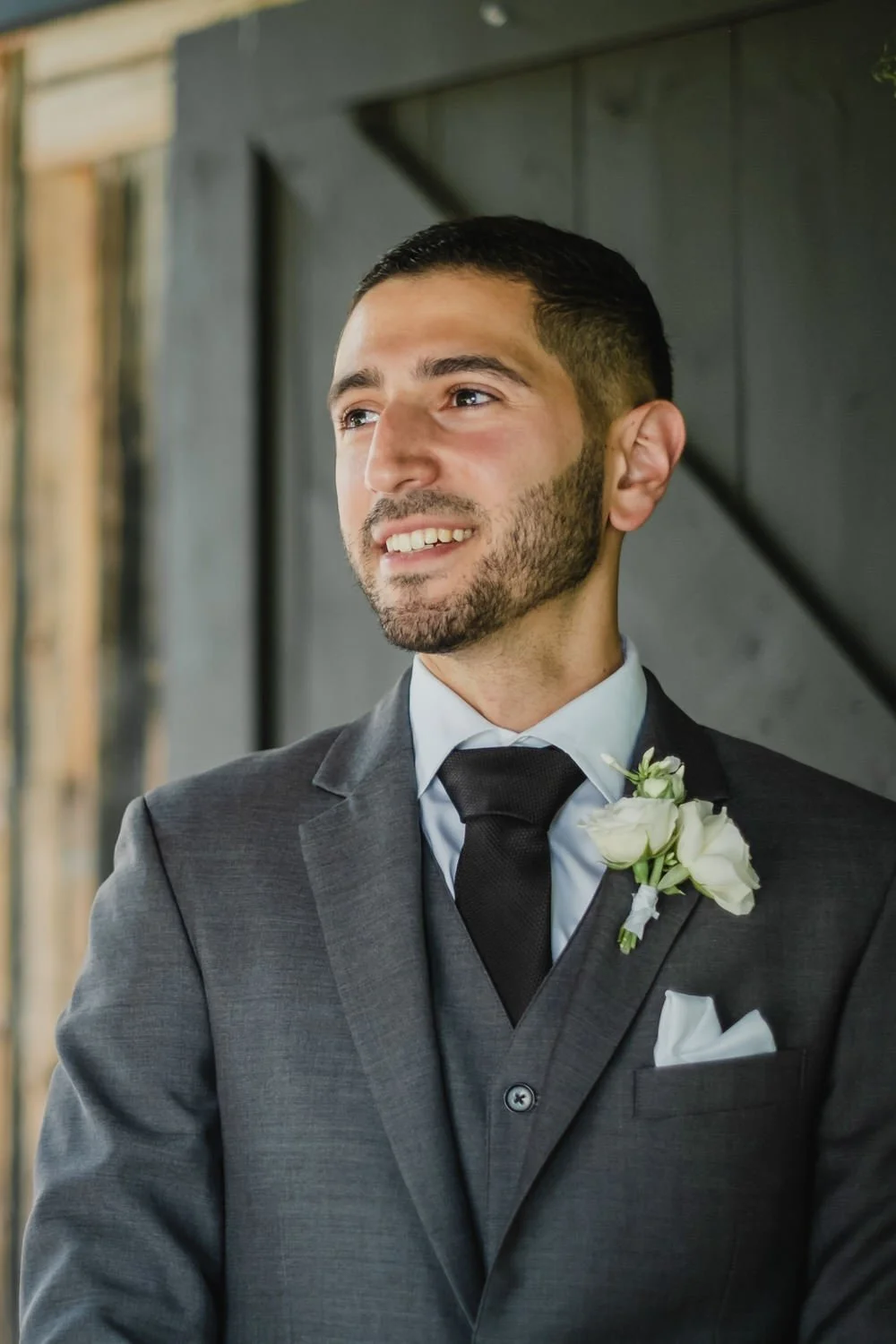 a photo of a groom waiting at the alter
