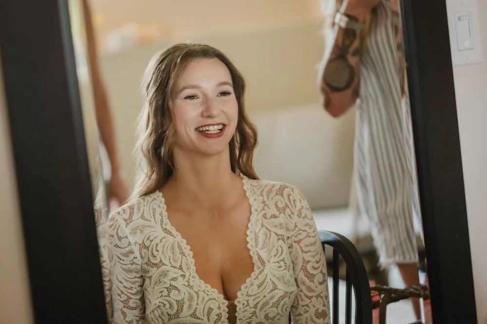 photo of a bride getting ready for her wedding ad Adelina barn