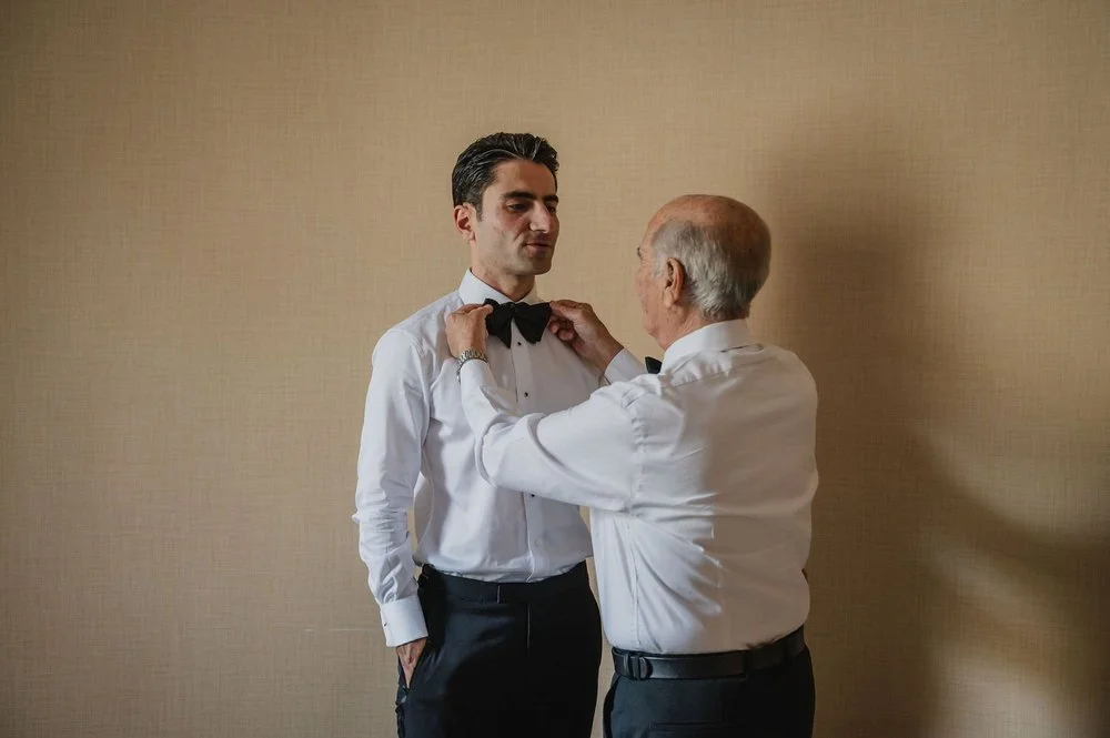 photograph of a groom getting ready for his wedding at the chateau laurier