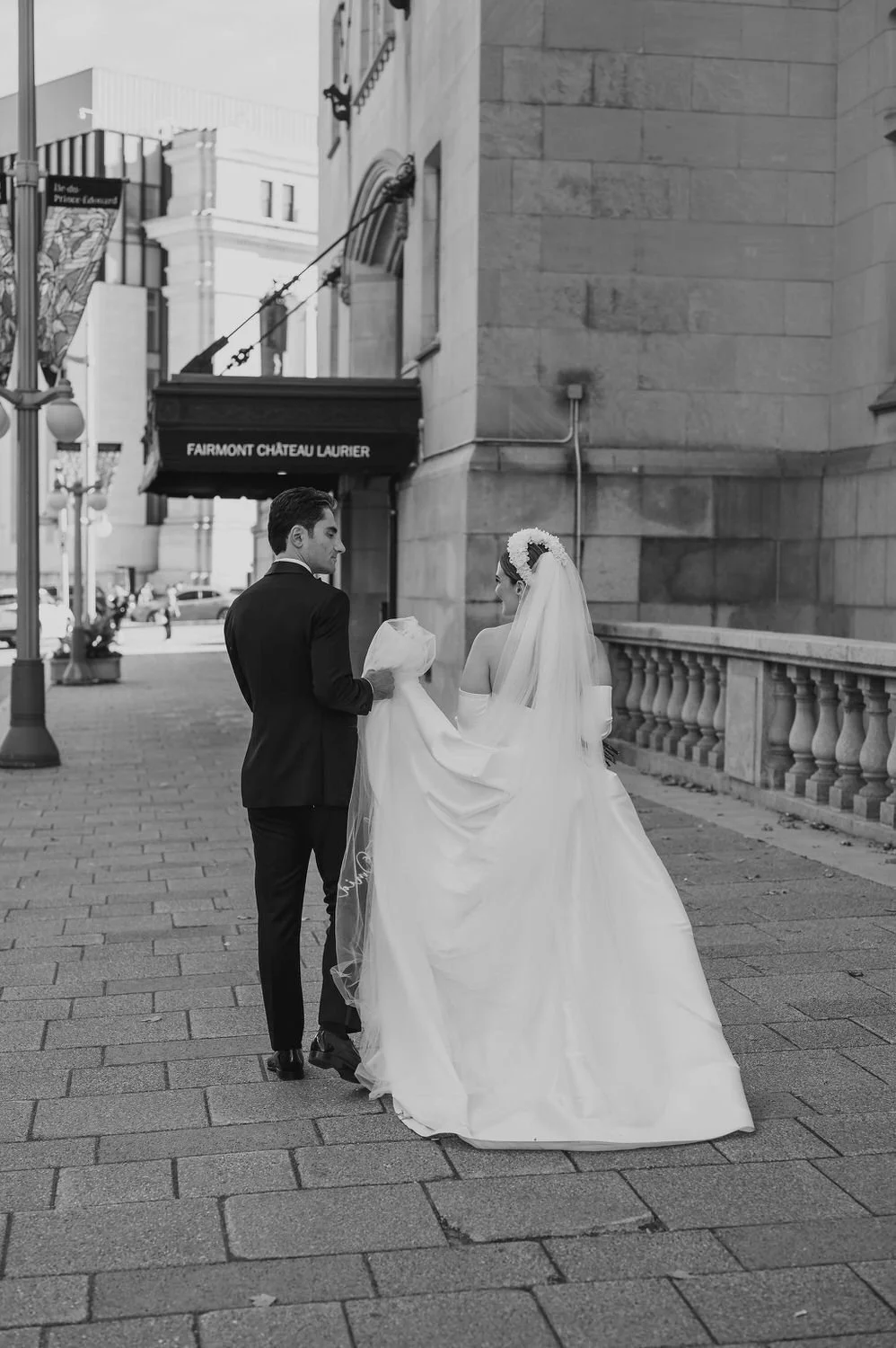 wedding photograph of a couple outside the chateau laurier in ottawa