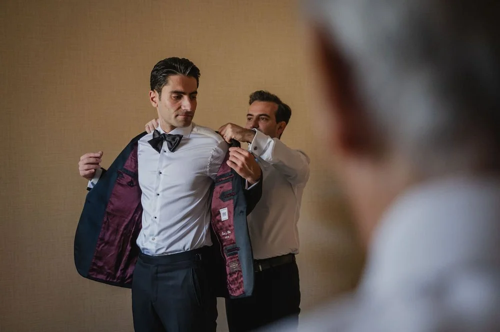 photograph of a groom getting ready for his wedding at the chateau laurier