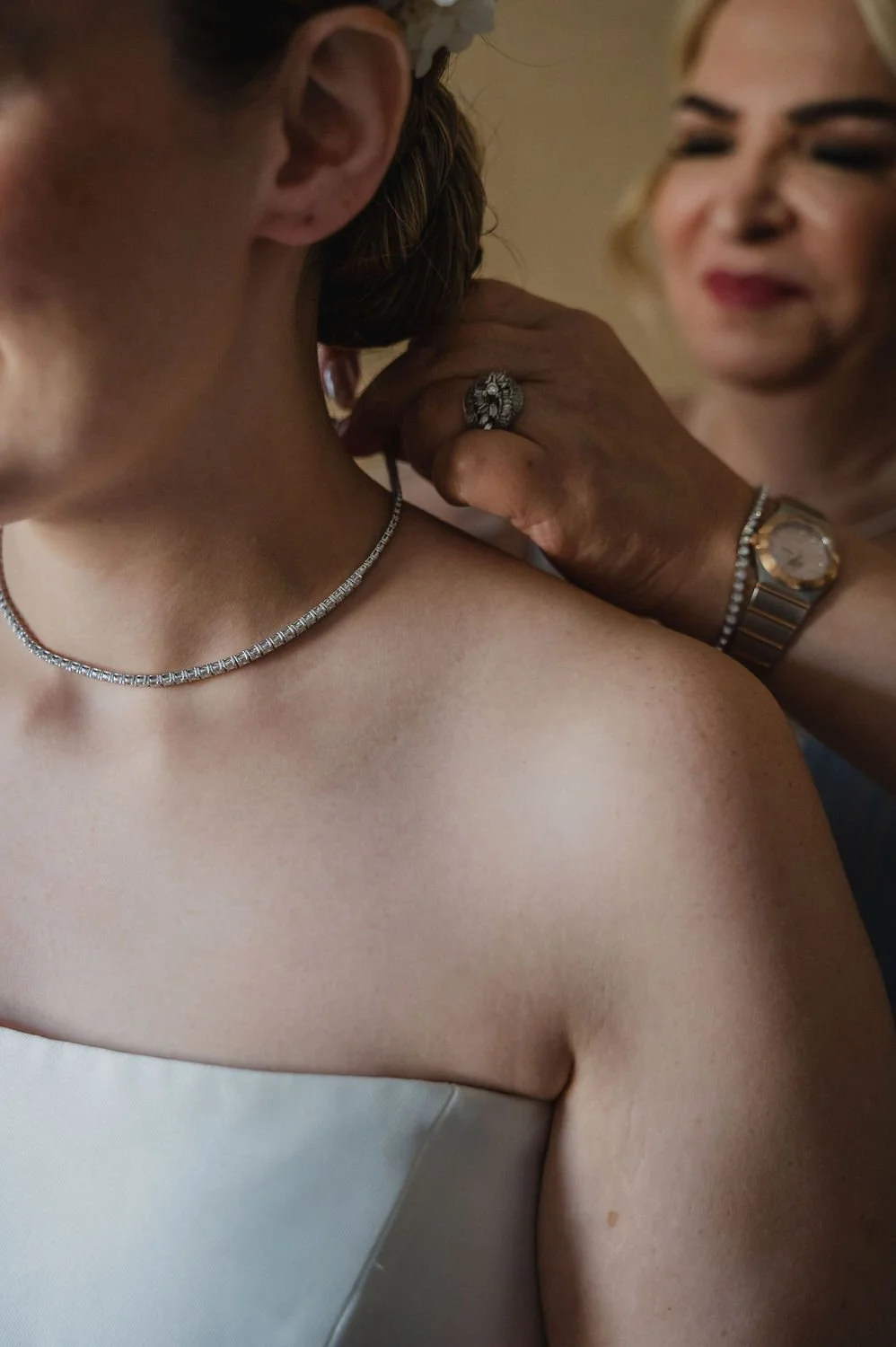 bride getting into her wedding dress in a suite at the chateau Laurier in ottawa