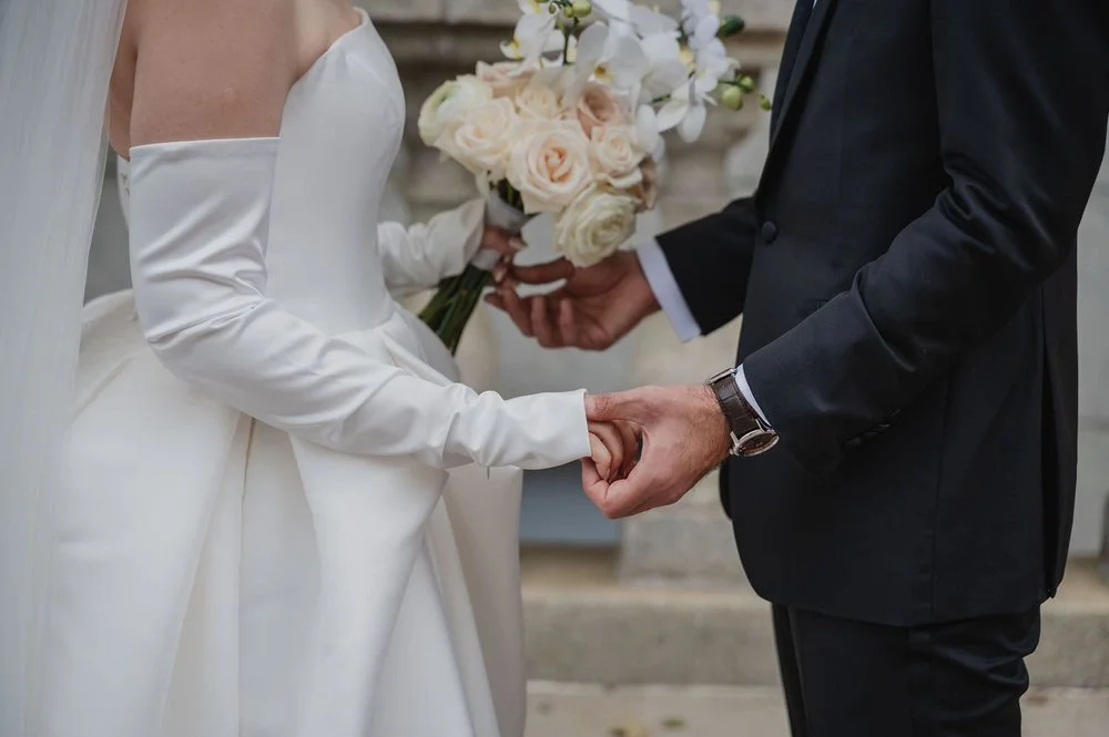 wedding photograph of a couple outside the chateau laurier in ottawa