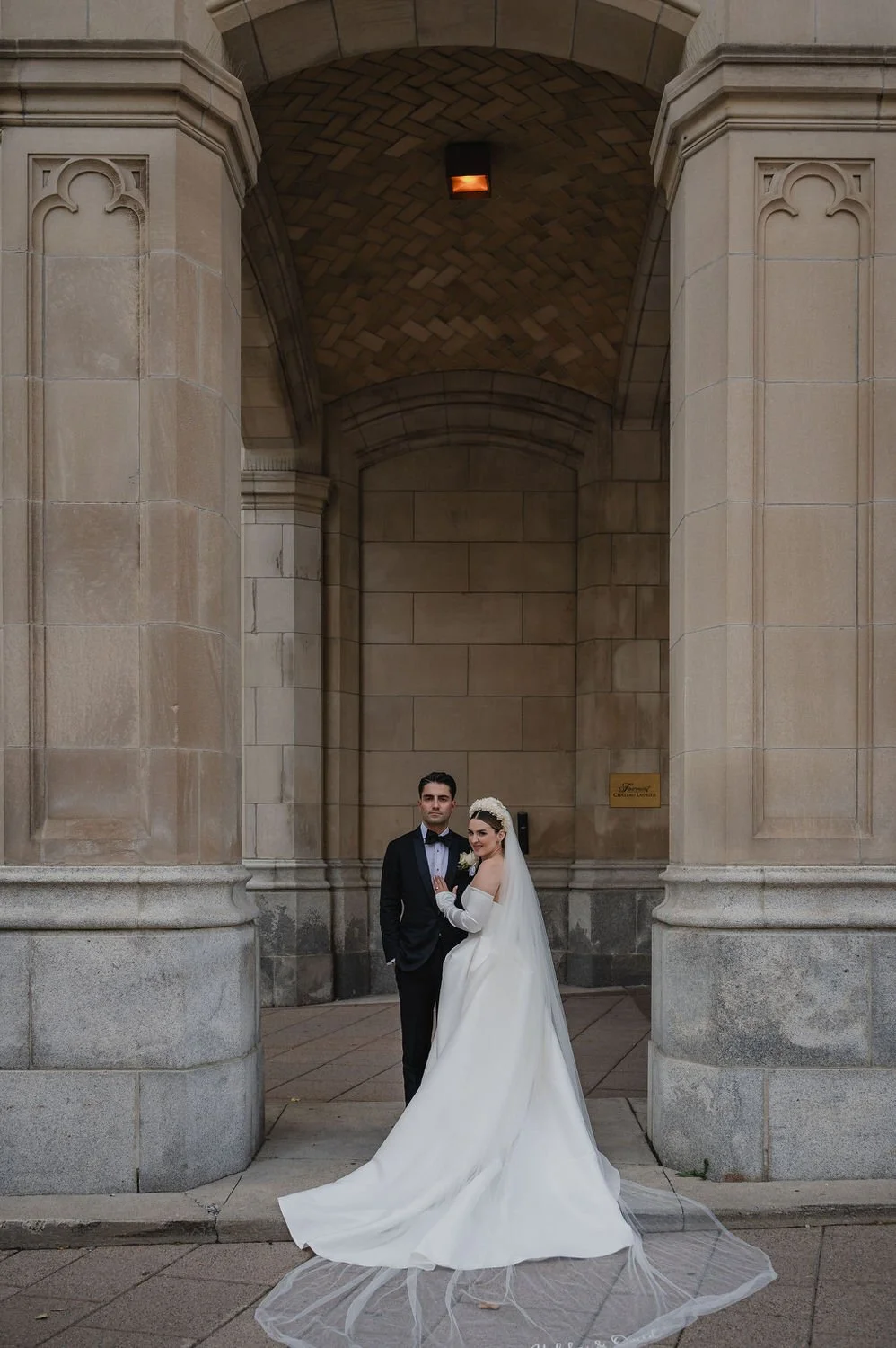 wedding photograph of a couple outside the chateau laurier in ottawa