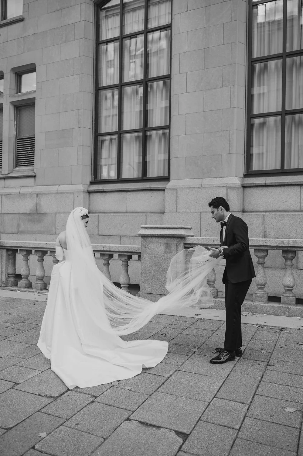 wedding photograph of a couple outside the chateau laurier in ottawa