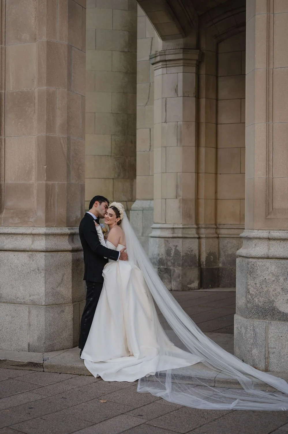 wedding photograph of a couple outside the chateau laurier in ottawa