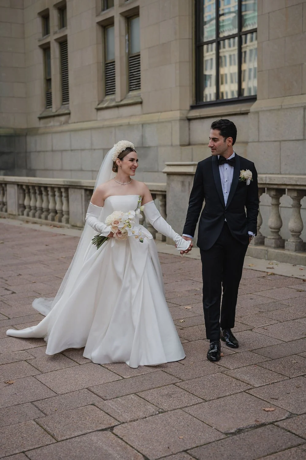 wedding photograph of a couple outside the chateau laurier in ottawa