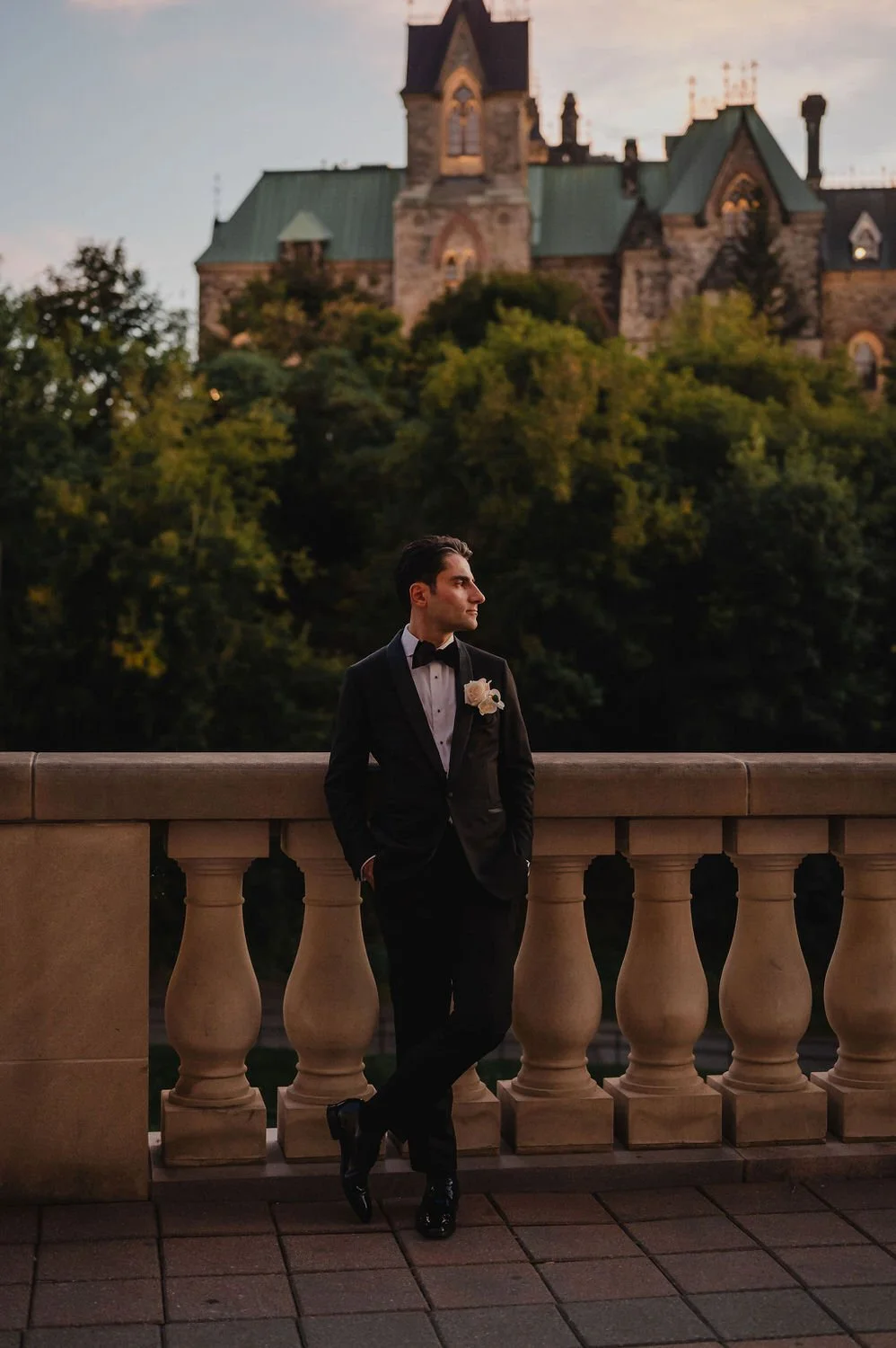 photograph of a stylish groom outside the chateau laurier