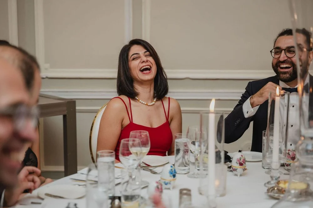 wedding guests laughing