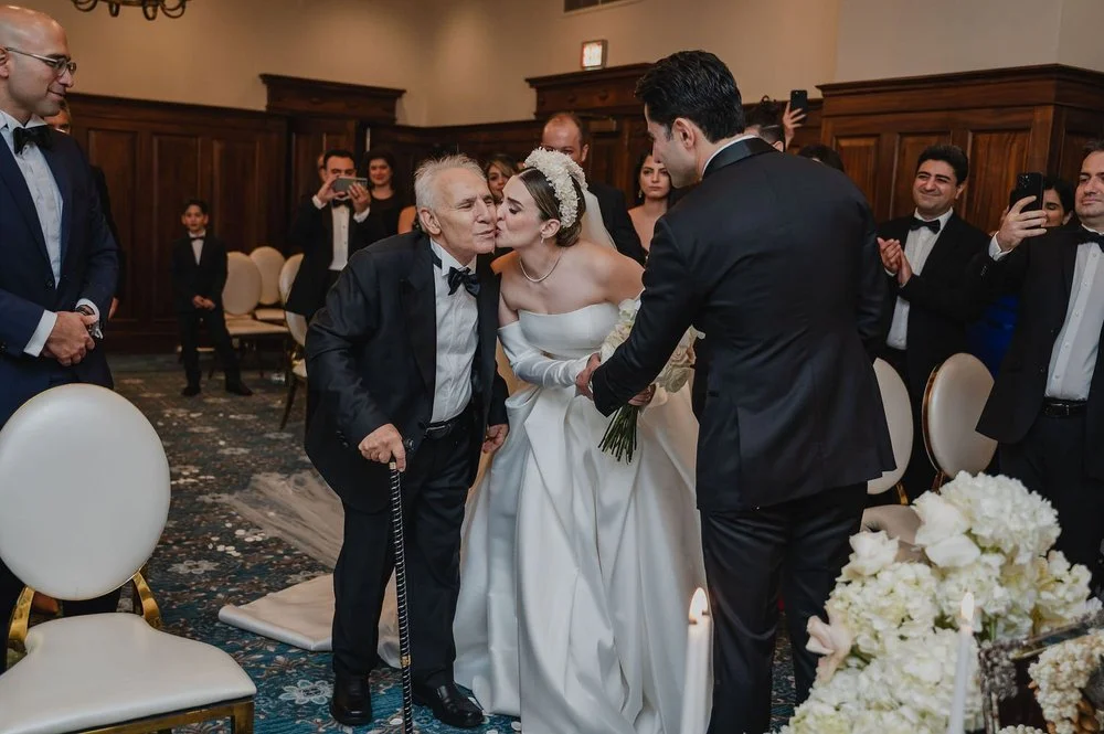 photo of a bride walking down the aisle at the chateau laurier