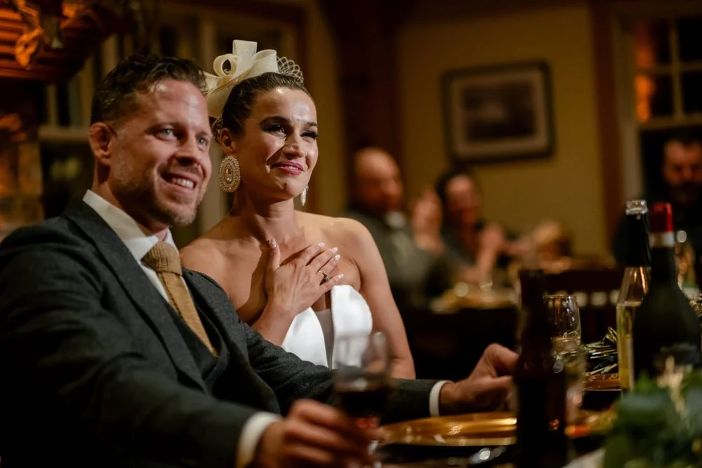 bride and groom reacting to a speech