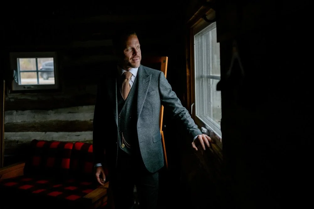 dramatic portrait of a groom at Temple's Sugar Bush