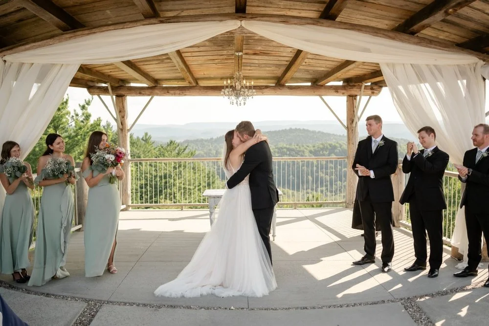 Bride and groom first kiss