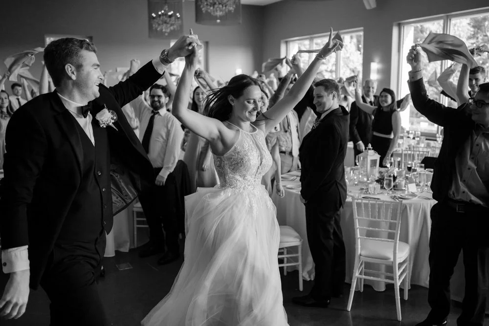 black and white photo of a grand entrance at le belvedere wedding