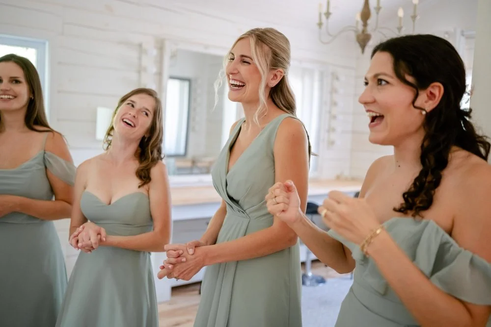 Bridesmaids laughing at Le Belvedere