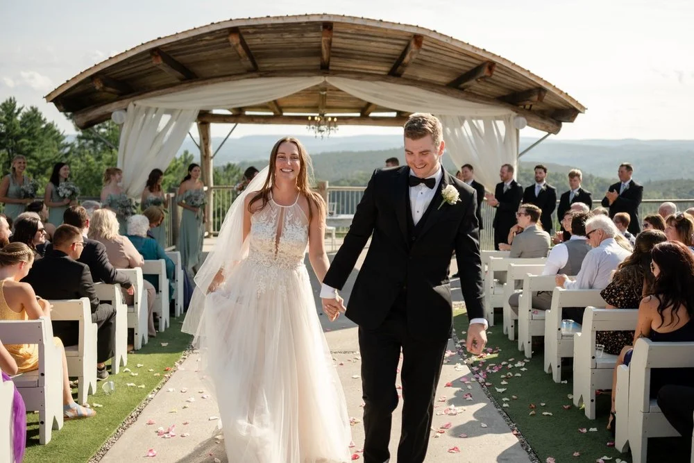 bride and groom walking back down the aisle at a le belvedere wedding ceremony