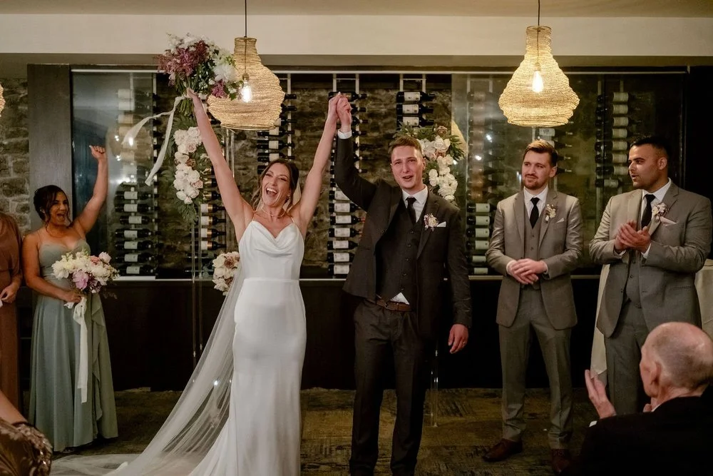 Bride and groom walking back down the aisle at Sidedoor Restaurant
