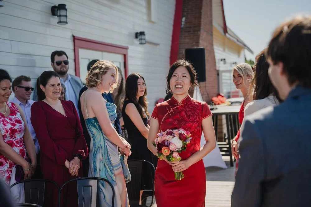 photograph of a bride walking down the aisle at her NCC River House wedding