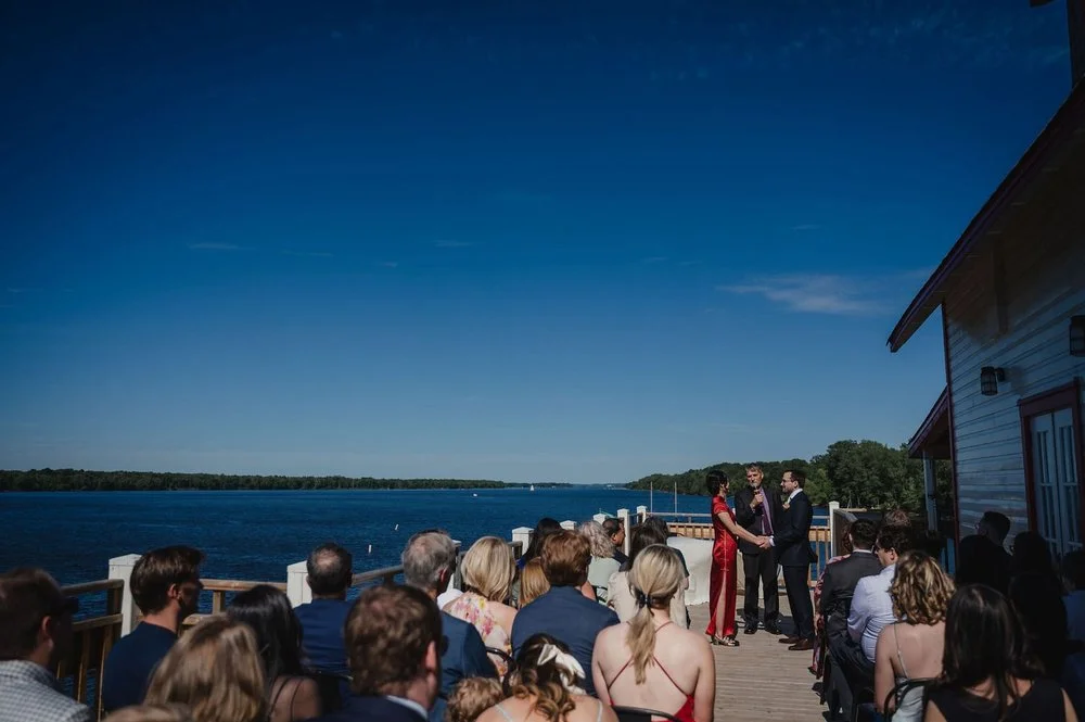a wedding ceremony at the NCC River House