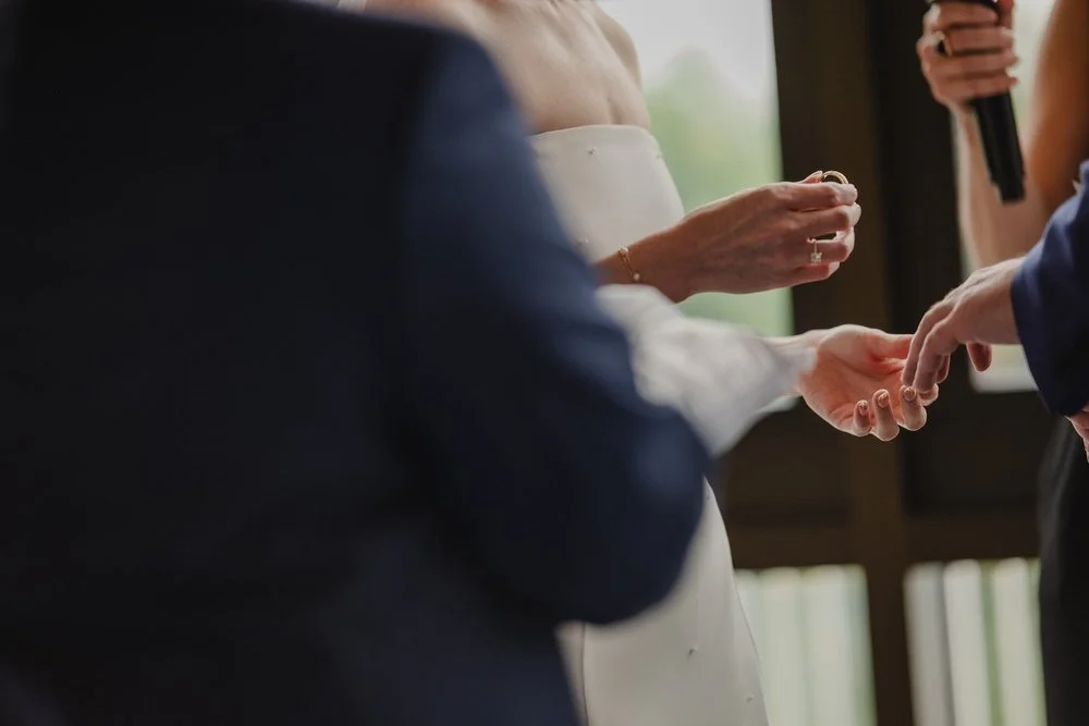 exchanging rings at a Lago wedding