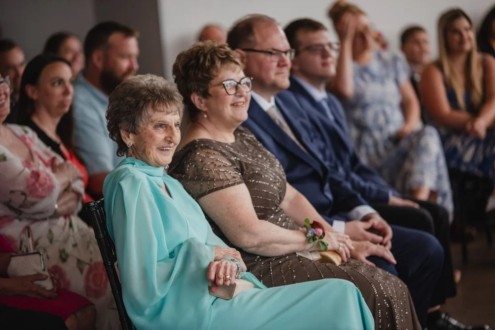 photograph of parents of the bride and groom at a Lago in ottawa