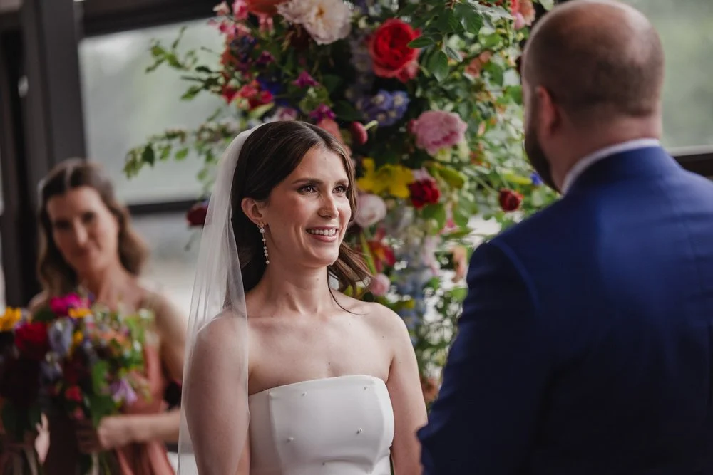 bride facing the groom at a Lago wedding