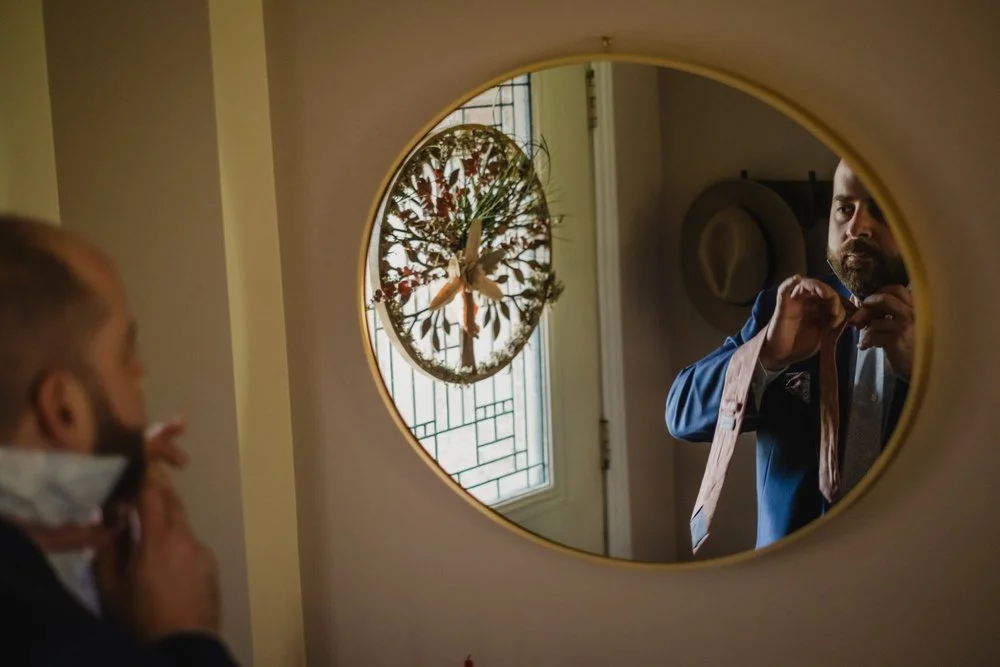 a groom getting ready for his wedding