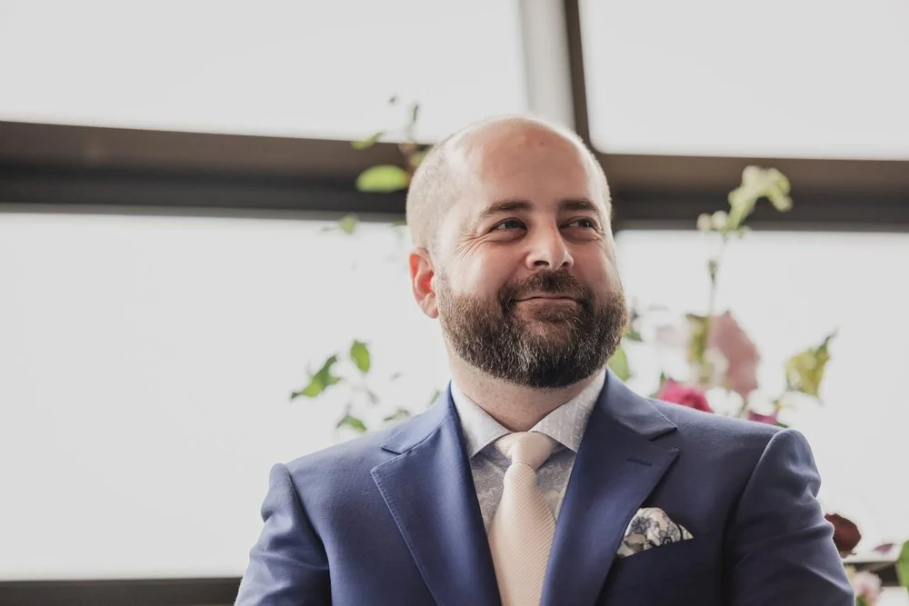 a groom reacting to seeing his bride walk down the aisle at Lago in ottawa